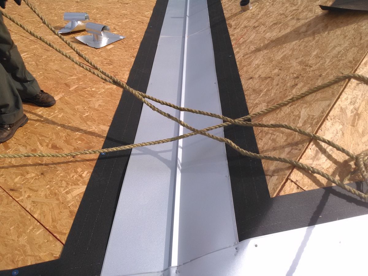 A roof ridge being prepped for roof installation
