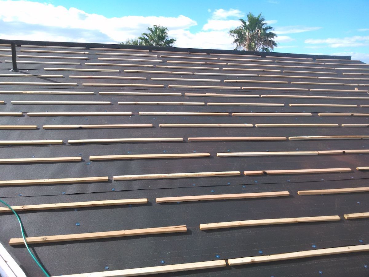 A roof with underlayment being prepared for shingles.