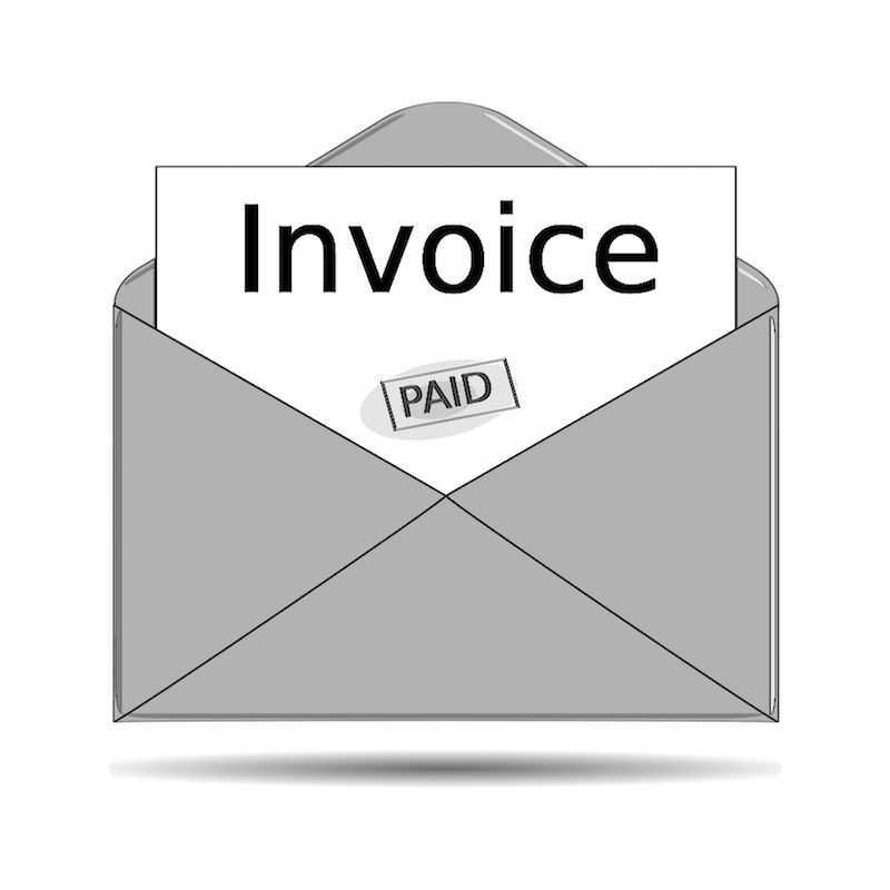 An envelope with an invoice inside of it.