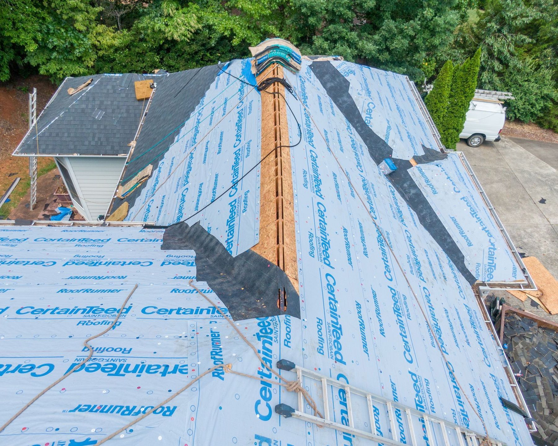 An aerial view of a roof with underlayment on it