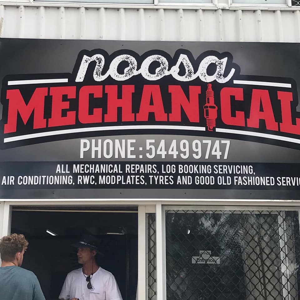 Two Men Standing in Front of a Noosa Mechanical Sign — Noosa Mechanical in Noosaville, QLD