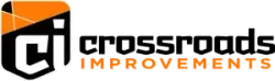 Crossroads Improvements logo with black and orange text and a stylized house icon