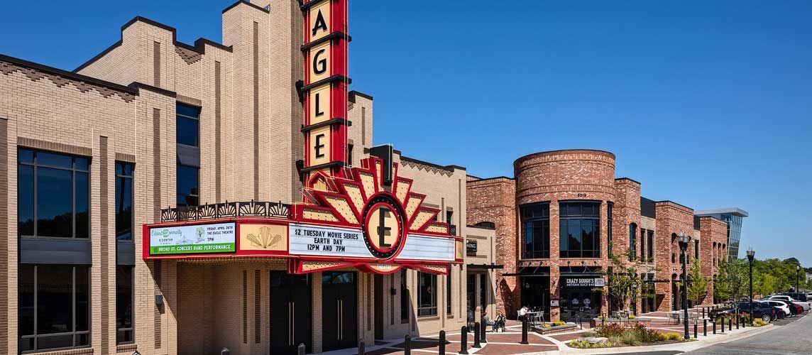 A large building with a red sign that says eagle on it.