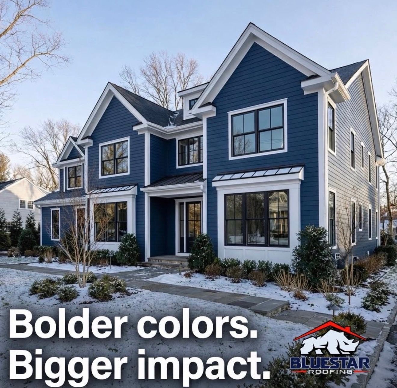 Blue two-story house with white trim and snow, overlaid text: “Bolder colors. Bigger impact.”