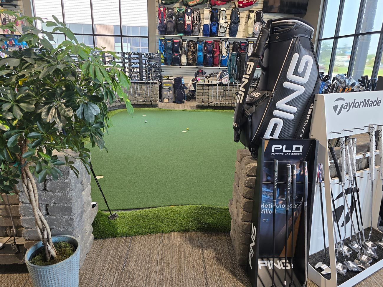 A ping golf bag is on display in a golf store.