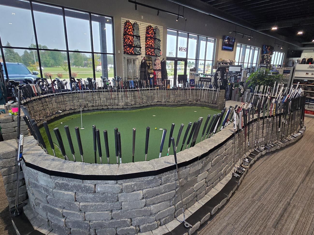 A large pond filled with fishing rods in a store.
