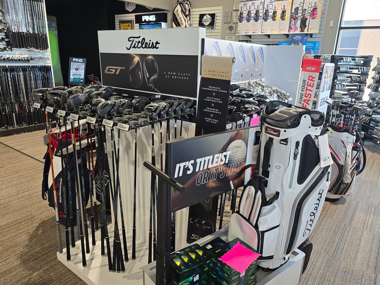 A golf store filled with lots of golf clubs and bags.