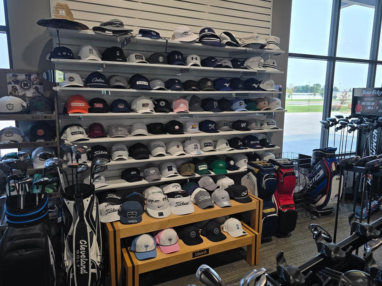 A store filled with lots of hats and golf bags.