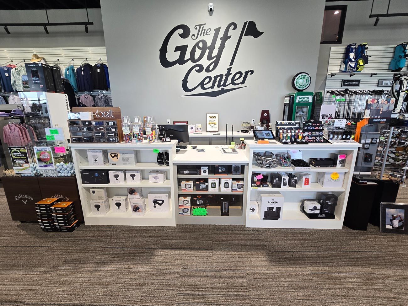 A store with a sign that says the golf center