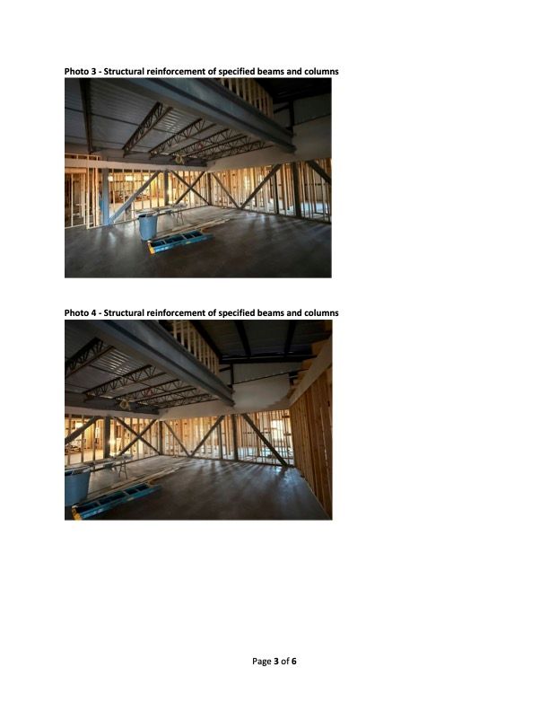 Interior view of a construction site showing structural reinforcement of beams and columns.