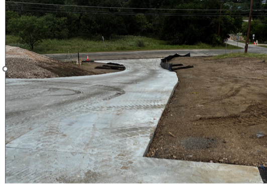 South driveway with improved interface with Sunrise Dr.