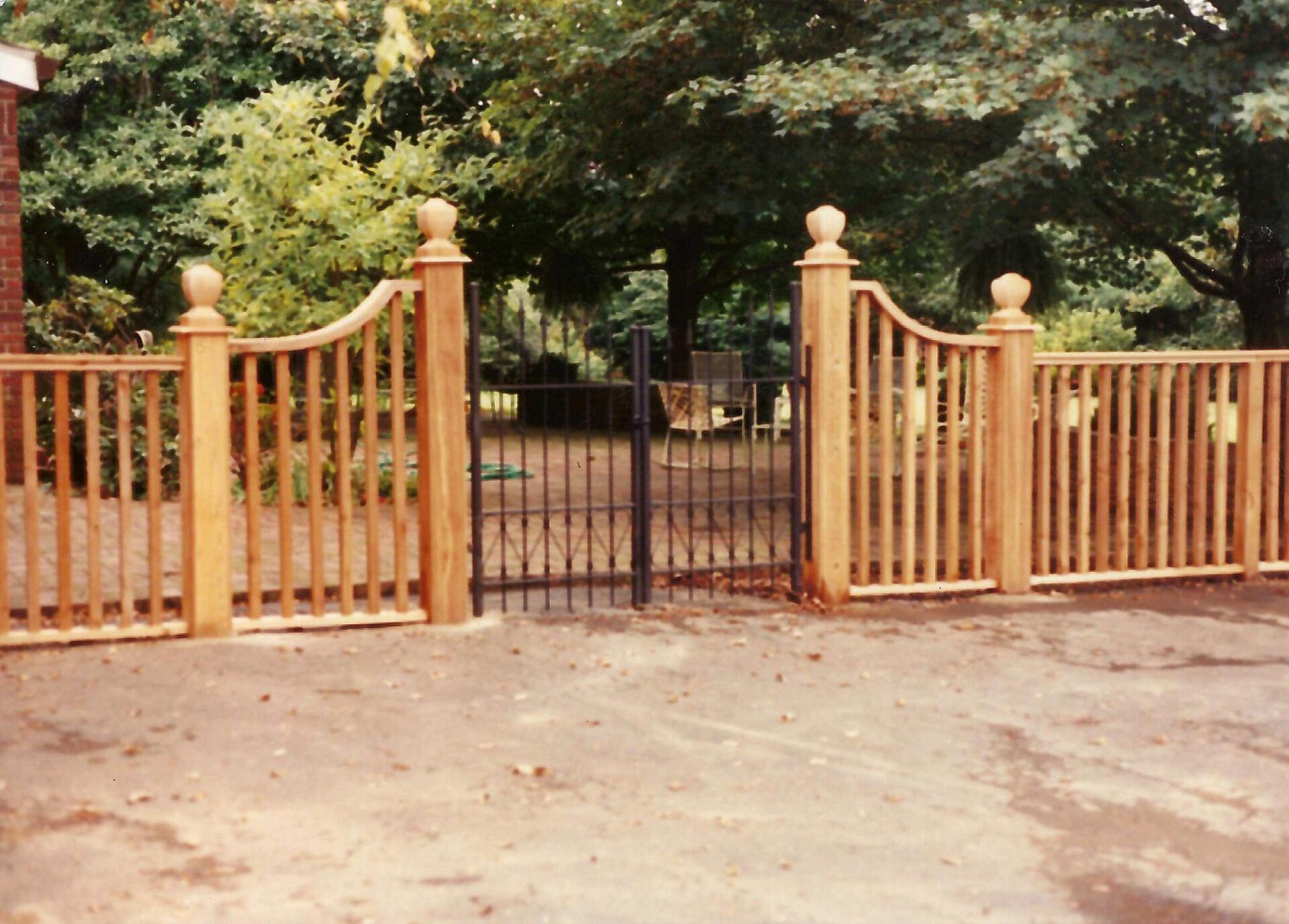 Wooden Fence And Iron Gate — Louisville, KY — Okolona Fence Co Inc
