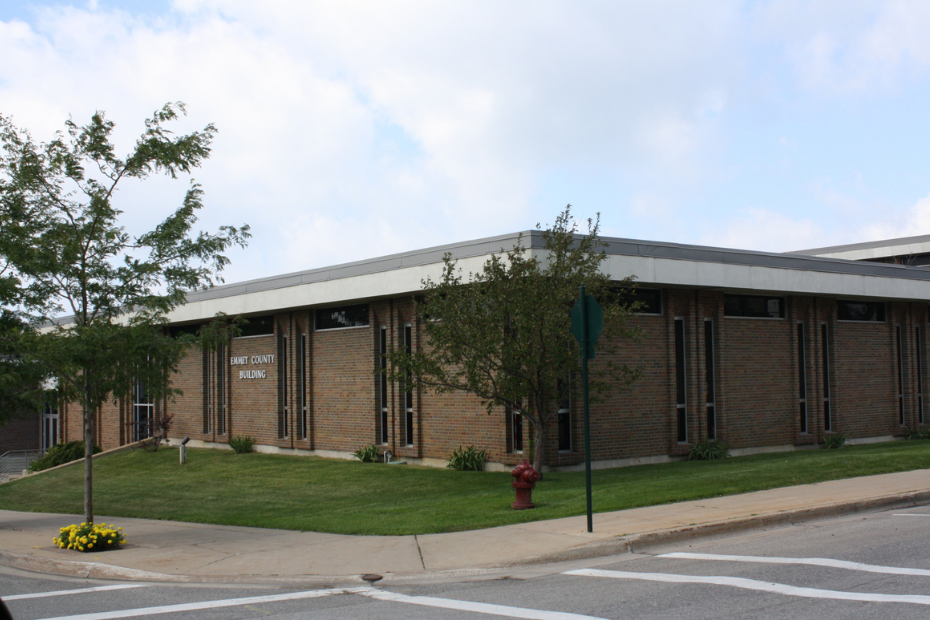 Brick building with large windows and a flat roof; 