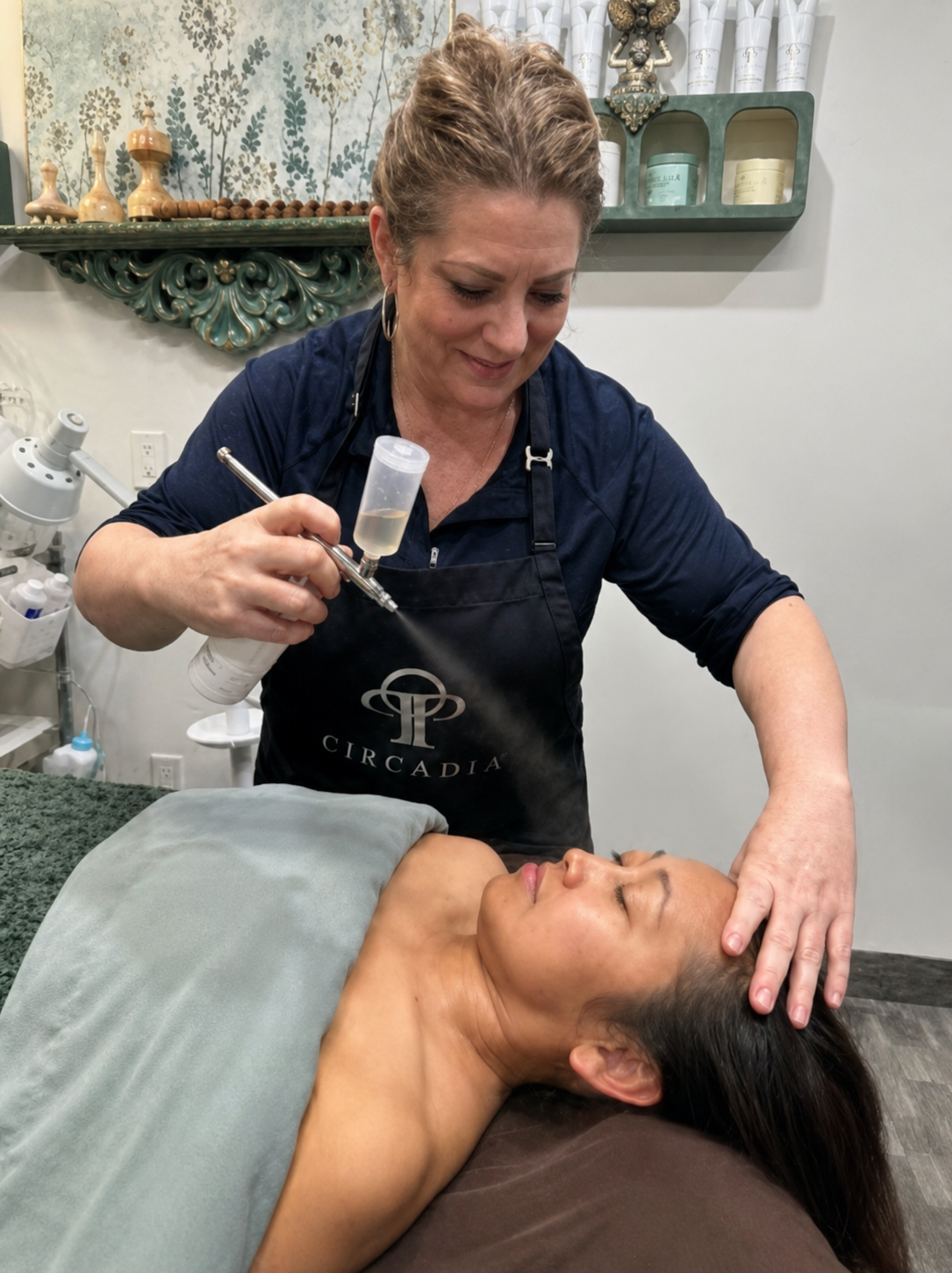 Hand in glove inserting acupuncture needles into skin.