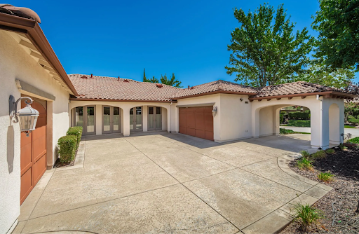 Hidden 3-car garage with epoxy floors and a spacious concrete driveway at 2121 Ladera Dr, a luxury home for sale in Lincoln, CA.