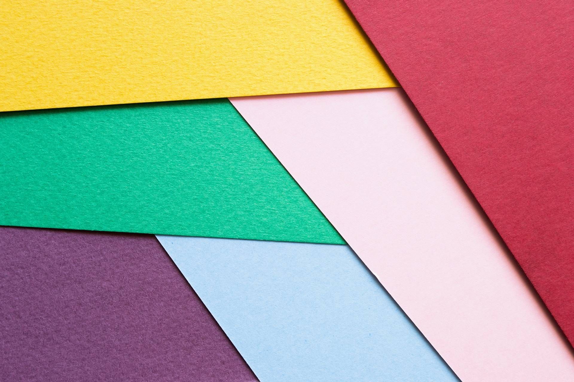 A close up of a bunch of different colored paper