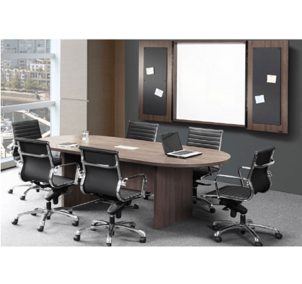 Oval conference table with six black chairs, whiteboard, and wood panel wall.