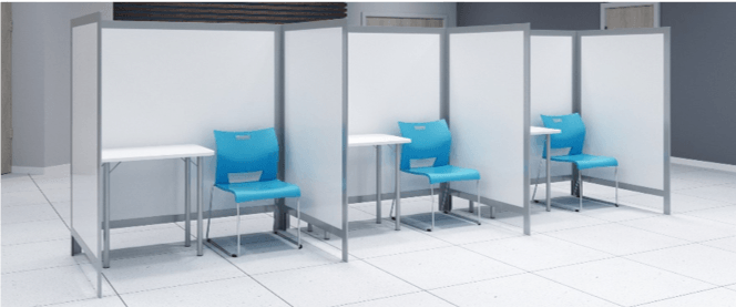 Three white partitioned booths with blue chairs and small tables in a brightly lit room.