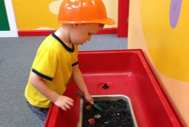 Boy playing cooking — Naples, FL — Whiz Kids
