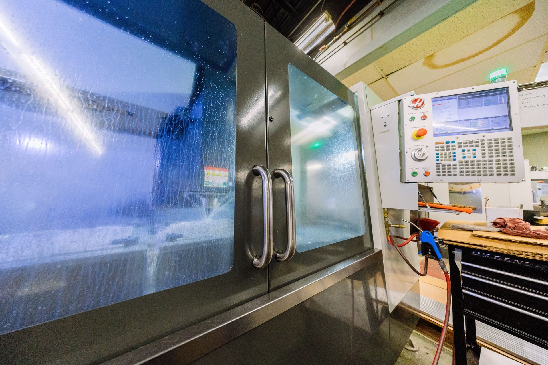 A machine is sitting in a cabinet in a factory.