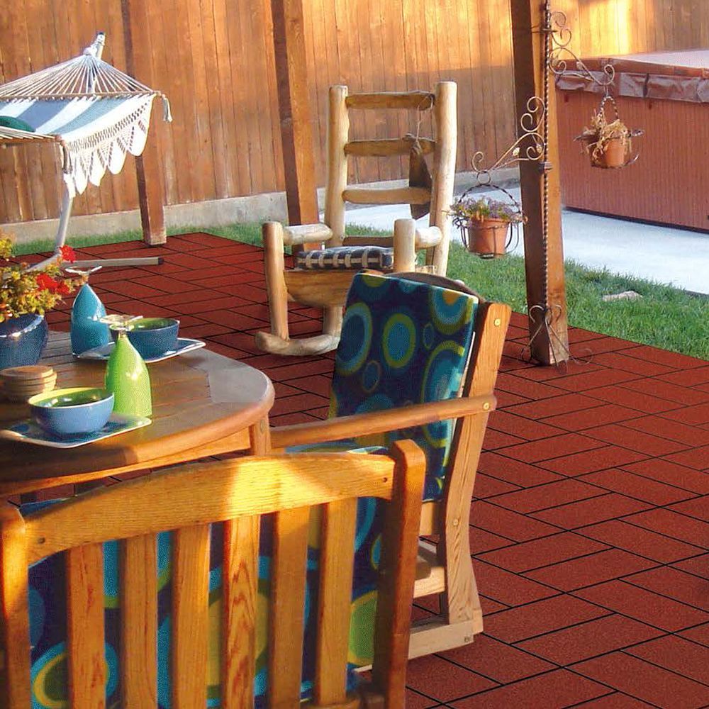 A patio with a table and chairs and a hammock