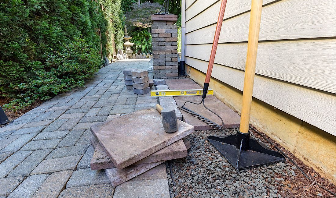 Paver walkway installation beside a Castle Rock, CO home