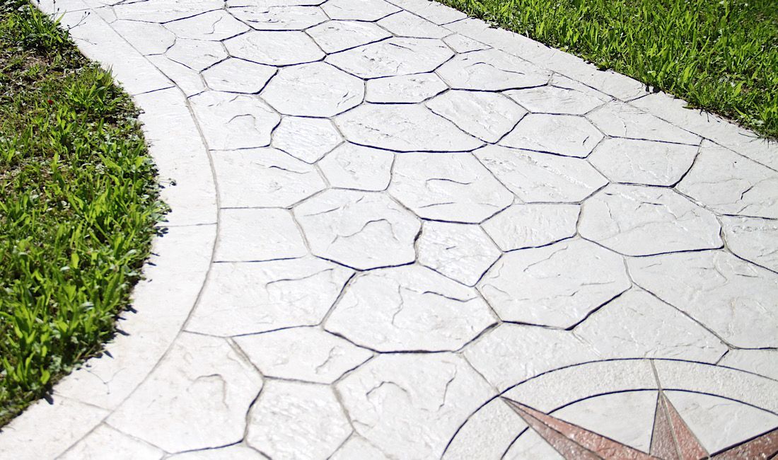 Gorgeous stamped concrete design located in commercial area to comply with the ADA.