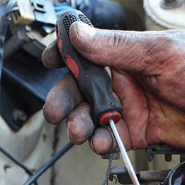 A Close up Of a Person Holding a Screwdriver in Their Hand — In CoolAir Auto Care Salamander Bay NSW, 2317