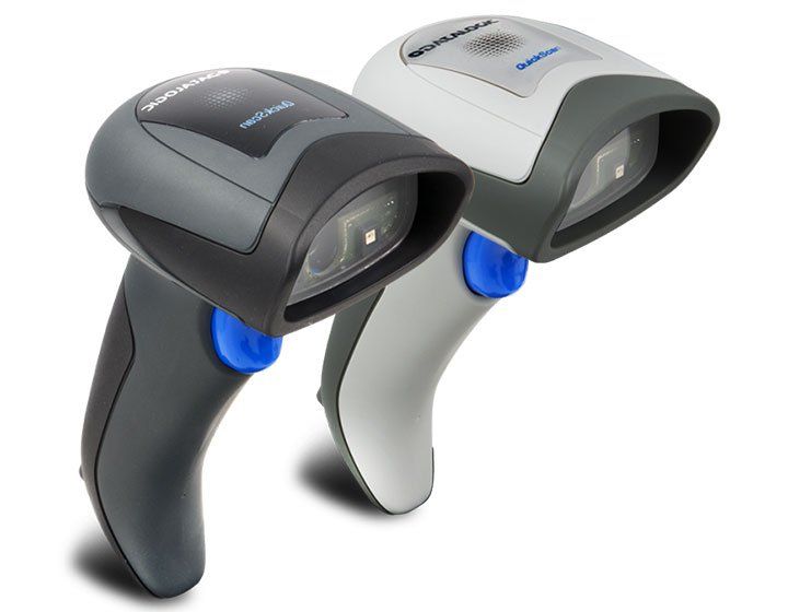 Person scanning a product at a checkout counter, using a black handheld barcode scanner.