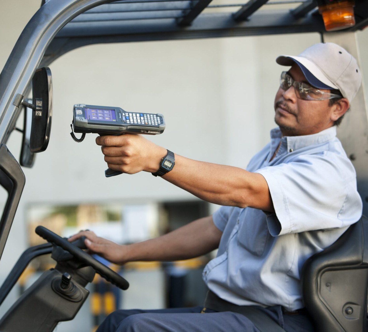 man holding honeywell mobile computer