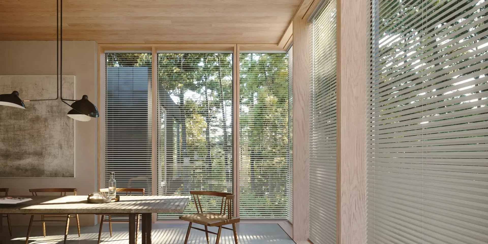 A living room with a couch , chair , table and blinds.
