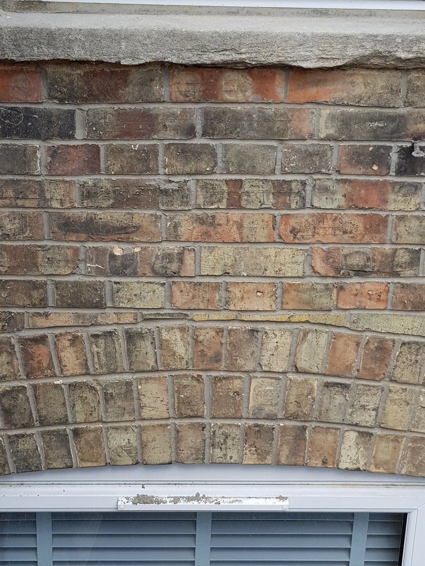 Raised patio and wall being built in garden