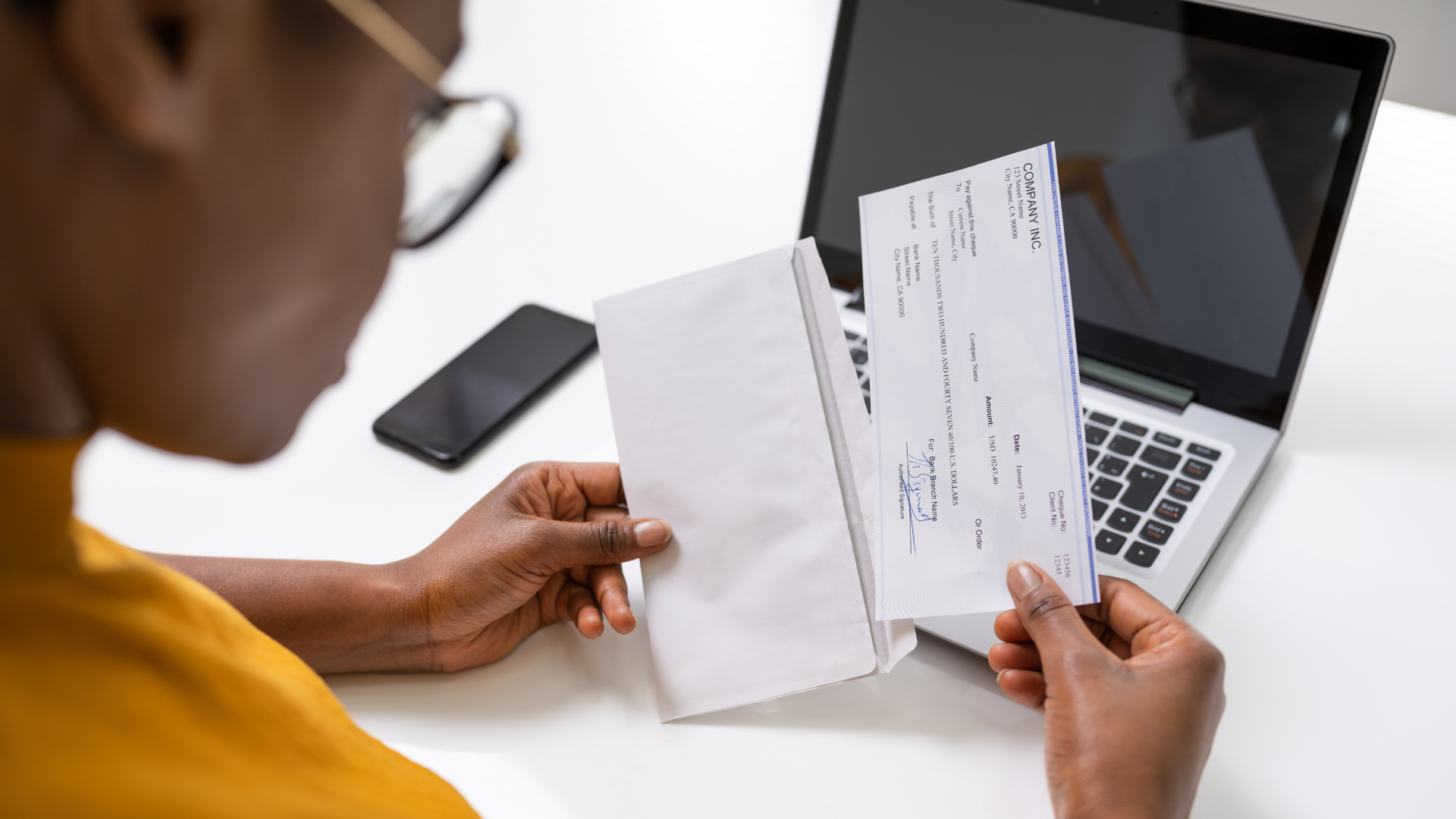 an American holding a paycheck, which isn't included in a credit report