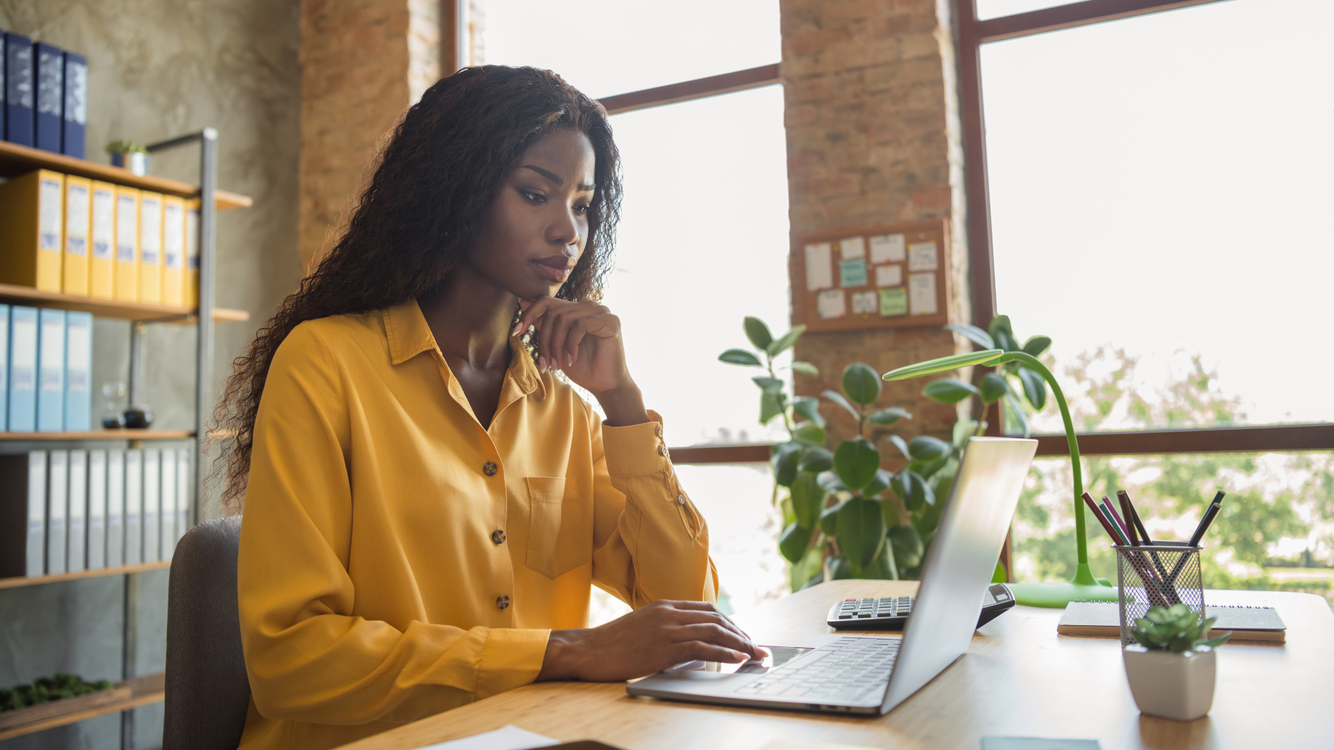 freelancer working through her laptop