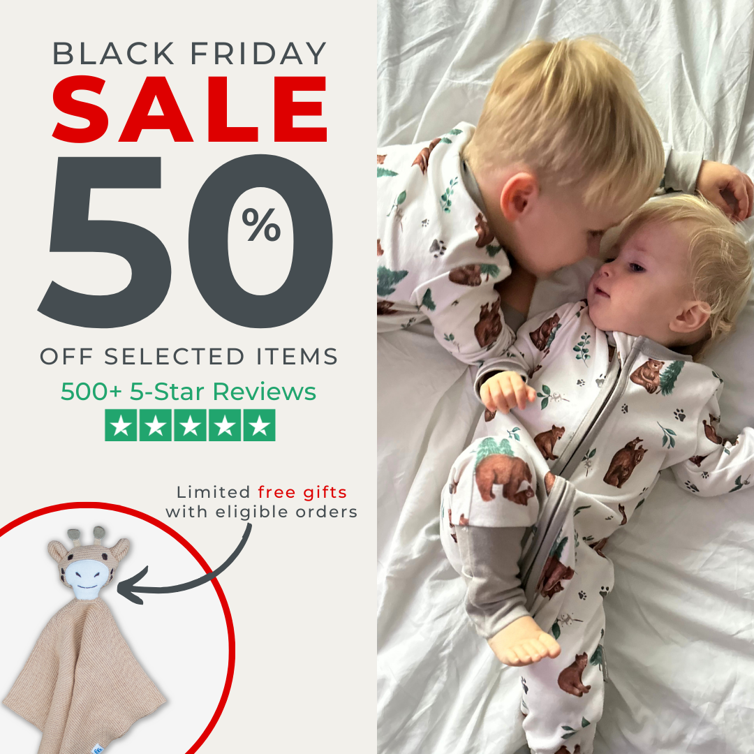 Black Friday sale: Two toddlers in pajamas, giraffe security blanket, 50% off selected items.