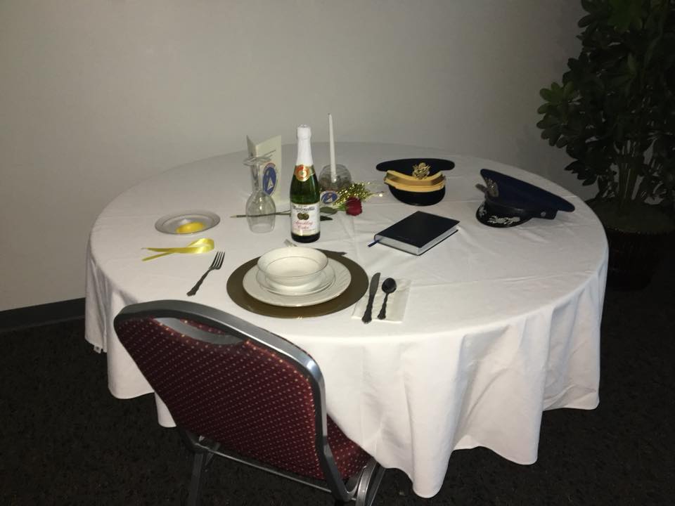 A round table with a bottle of wine on it