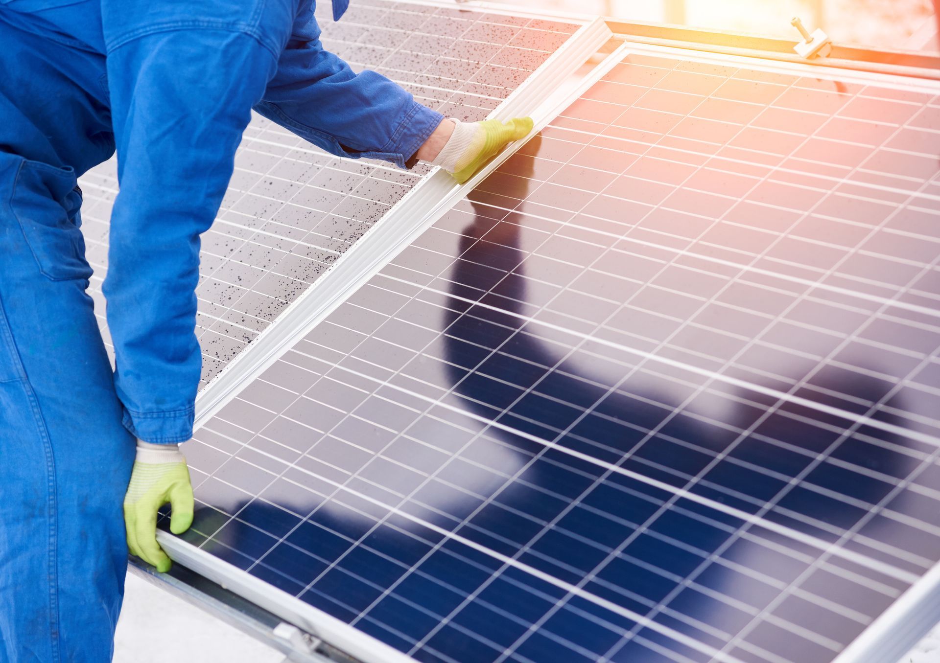 Worker Installing Solar Panels on Roof — Mildura, Vic — CFB Group