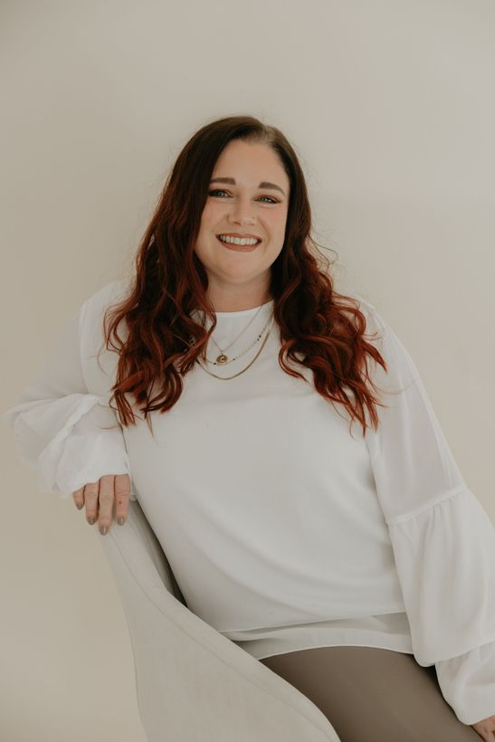 A woman is sitting in a chair