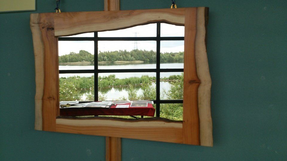 image of a wall mirror with english yew frame made by Patrick Turk the owner of Forest 2 Furniture using timber milled and dried by him