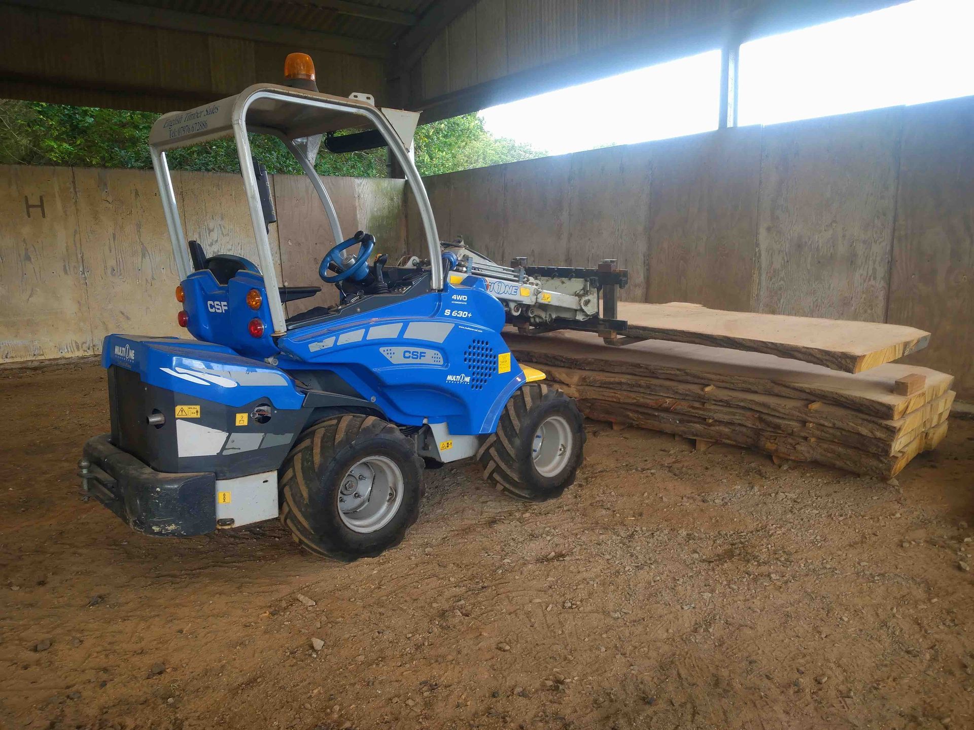 Moving the milled planks with my own loader is far easier and safer than by hand with staff.
The loader doesn't moan as much either!