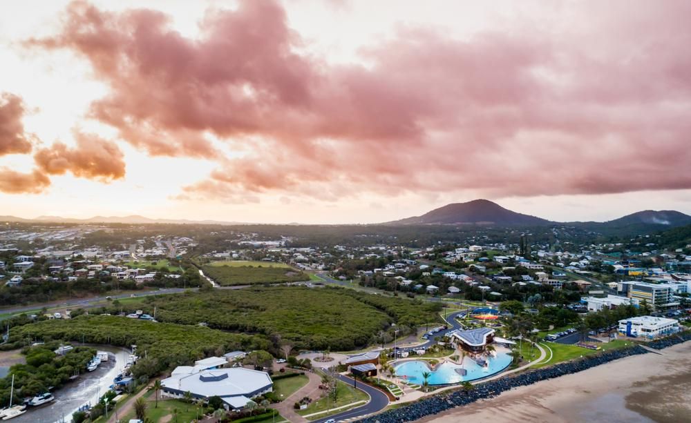 An Aerial View Of A City And A Beach At Sunset — ADK Coatings In Yeppoon, QLD