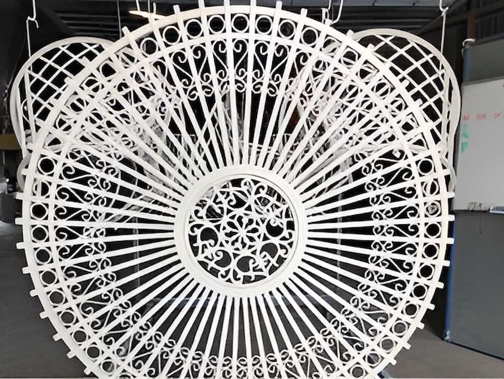 A Large White Fan Is Hanging From The Ceiling In A Room — ADK Coatings In Bundaberg, QLD