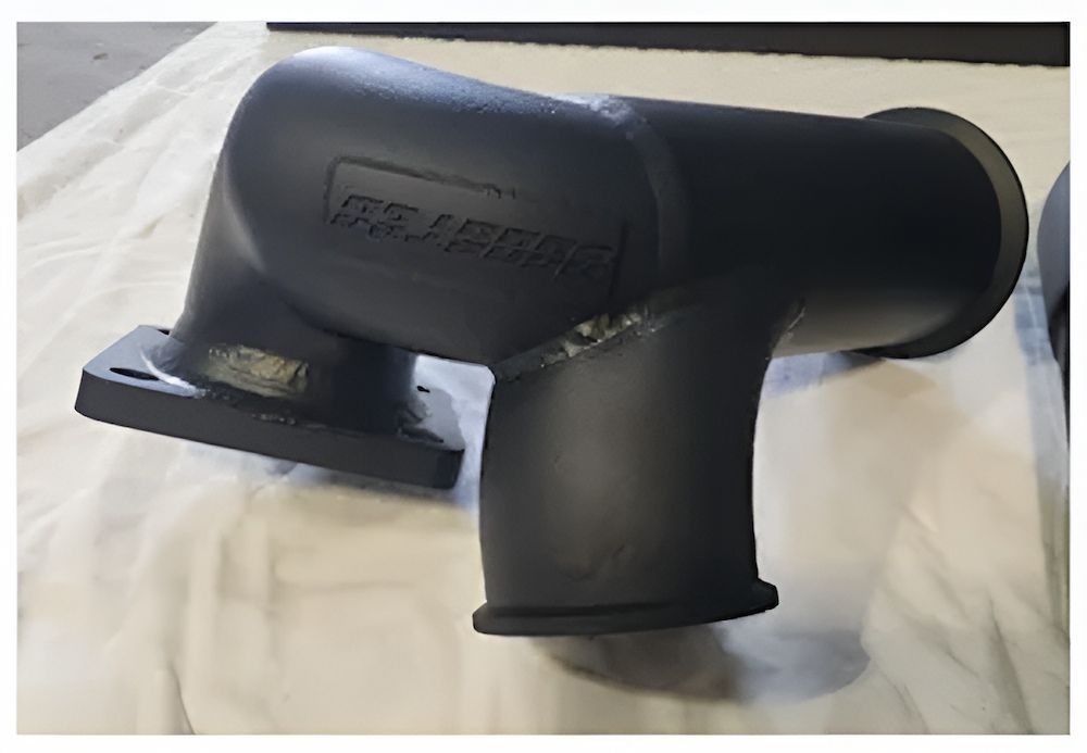 A Black Pipe Is Sitting On A White Cloth On A Table — ADK Coatings In Toolooa, QLD