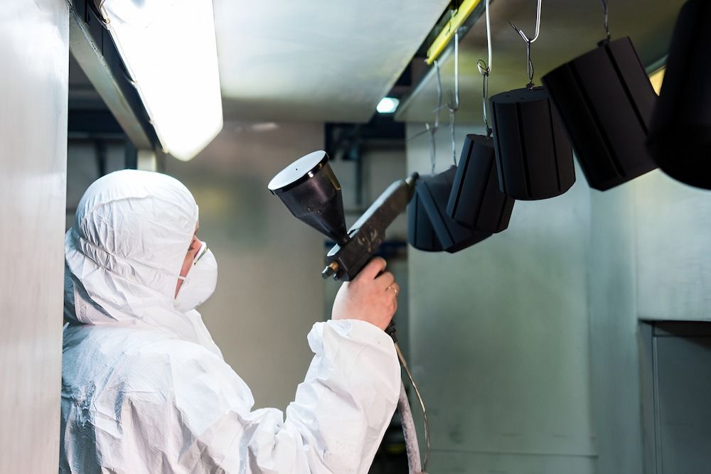Man In A Protective Suit Sprays — ADK Coatings In Toolooa, QLD