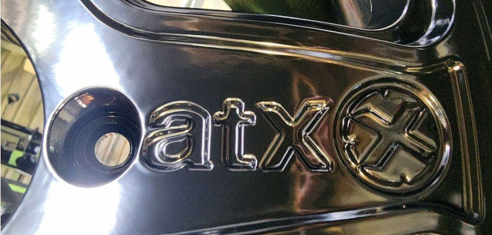 A Close Up Of A Car Wheel With The Word Atx On It — ADK Coatings In Agnes Water, QLD