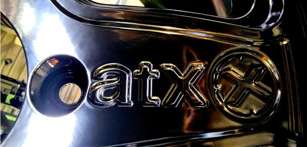 A Close Up Of A Car Wheel With The Word Atx On It — ADK Coatings In Toolooa, QLD