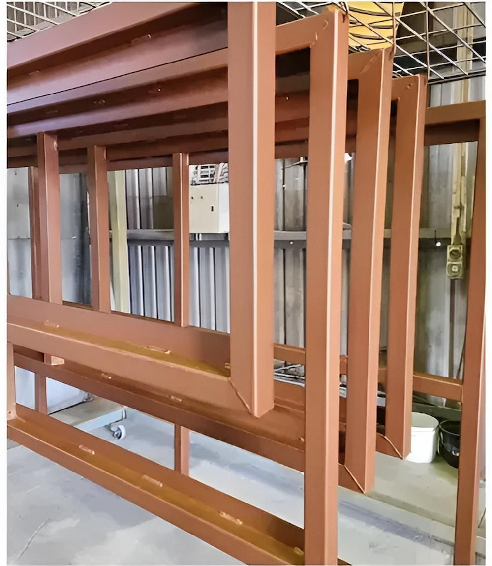 A Bunch Of Wooden Frames Are Stacked On Top Of Each Other — ADK Coatings In Toolooa, QLD