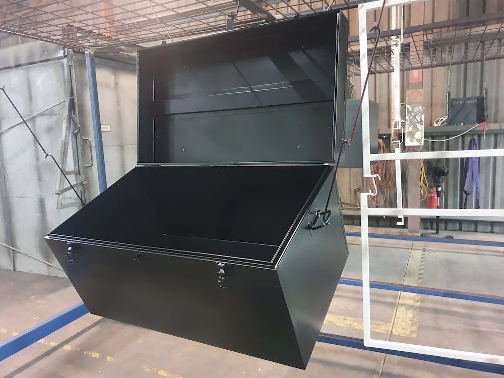 A Black Box Is Hanging From A White Railing In A Room — ADK Coatings In Tannum Sands, QLD