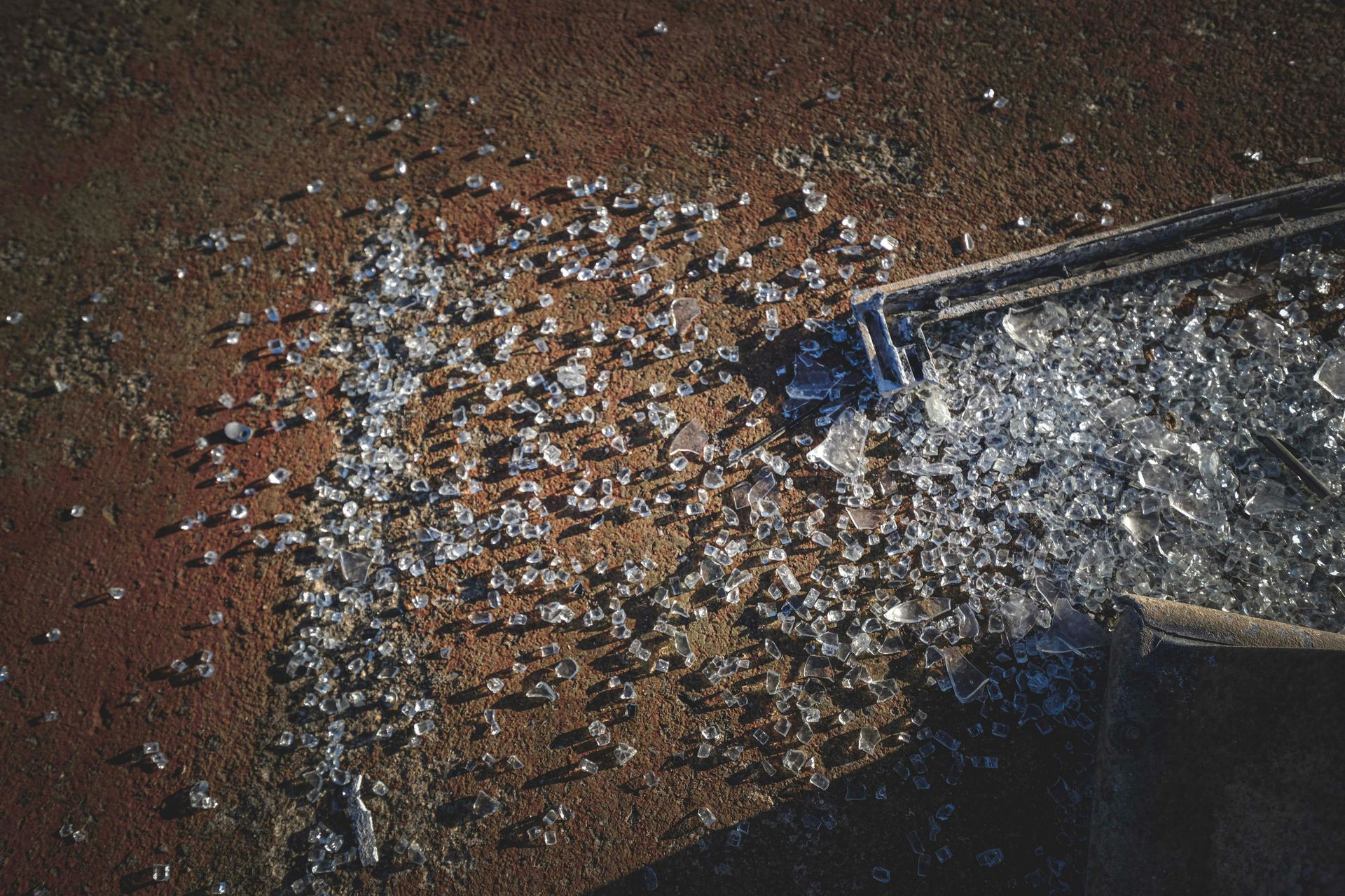 A close up of a piece of broken glass on a table.