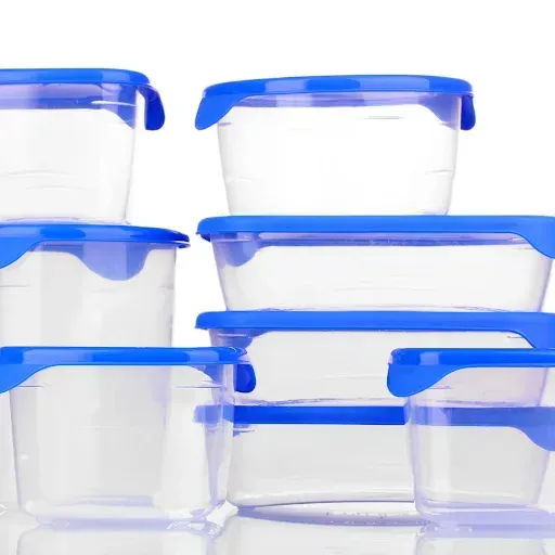 A group of plastic containers with blue lids are stacked on top of each other